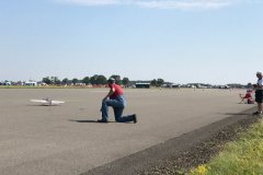 A control line stunt model being launched